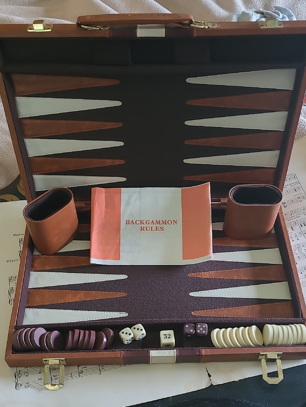 Vintage faux leather backgammon set in a travel briefcase style. Made In Taiwan.